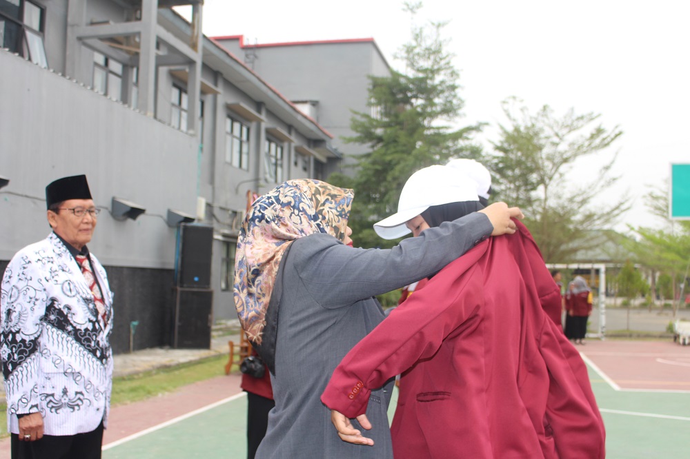 KETUA STIE PGRI DEWANTARA JOMBANG MEMIMPIN PEMBUKAAN PK2MABA TAHUN AKADEMIK 2019-2020